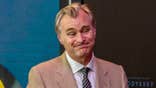 Christopher Nolan is seen on the red carpet of a screening for "The Odyssey"