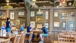 Customers eat at tables inside a Cracker Barrel Old Country Store in Vero Beach, Florida.