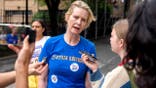 Cynthia Nixon speaks with reporters during New York primary election.