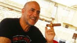 Daniel Siad images with a cigar.