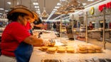 Employees prepare food inside Buc-ee's convenience store in Luling, Texas.