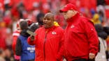Eric Bieniemy and Andy Reid talk before an AFC divisional playoff game.