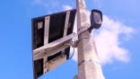 A Flock Safety-branded license plate reader camera site on a lamppost near the intersection of Peacock Drive and Bristol Road in Ventura on Sept. 9, 2025.