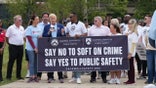 Gianno Caldwell holds sign during march