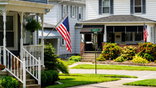 American flags hang outside homes in Greensburg, Pennsylvania, on June 3, 2024.