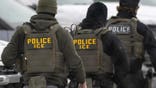 ICE agent walks in uniform