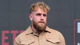 Jake Paul stands at an MMA press conference.