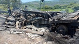 Burned wreckage of semi truck