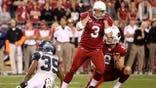 Jay Feely celebrates after kicking the game-winning field goal in overtime.