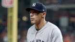 Joe Girardi walks back to the dugout during Game 7 of the American League Championship Series.