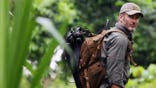 Joel Lambert trekking through the Panama forest.
