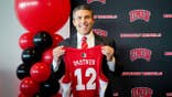 Josh Pastner poses with his new UNLV basketball jersey at a news conference.