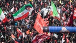 Thousands of mourners await the arrival of the body of Iran's slain Supreme Leader Ayatollah Ali Khamenei on July 09, 2026 in Mashhad, Iran.
