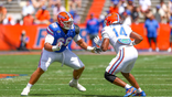 Emeka Ugorji #66 and KJ Ford #14 battle during the Florida Gators Orange and Blue Game.