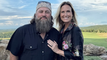 Willie and Korie Robertson in a field