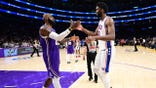 LeBron James and Philadelphia 76ers big Joel Embiid dap each other up after a game on at Crypto.Com Arena in Los Angeles.
