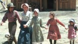 Little House on the Prairie cast members posed together in a promotional photo