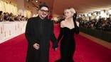 Marcus Mumford and Carey Mulligan stand together at the 96th Oscars.