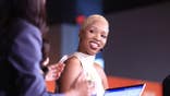 Monica McNutt smiles at the 2026 WNBA draft in New York.