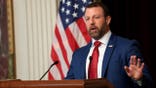 sec mullin at podium