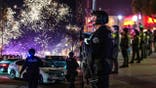 split image shows officers patrolling the city's streets with fireworks going off