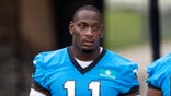 Nic Scourton walks to Carolina Panthers training camp.
