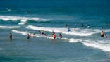 People cool off in the ocean at Kure Beach, North Carolina.