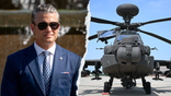 Pete Hegseth aside from an Apache helicopter