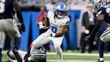 Reddy Steward tackles Jahmyr Gibbs during a Cowboys-Lions game at Ford Field.