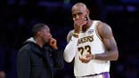 Rich Paul talks with LeBron James #23 during a Lakers game at Crypto.com Arena.