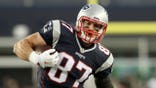 Rob Gronkowski runs with the ball after a catch during an AFC divisional playoff game.