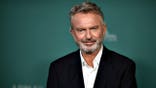Sam Neill arrives at a premiere in Los Angeles.