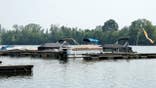 Boats sit moored on the Scioto River in Powell, Ohio.