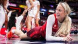 Sophie Cunningham smiles after falling on the court during an Indiana Fever game.