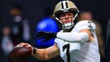 Taysom Hill warms up before an NFL game at Mercedes-Benz Stadium in Atlanta.