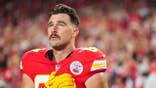 Travis Kelce looks on before kickoff at Arrowhead Stadium.
