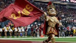 The Spirit of Troy waves a flag at Allegiant Stadium in Las Vegas.
