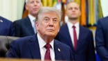 President Donald Trump speaks during an announcement in the Oval Office.