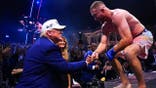 Justin Gaethje speaks with President Donald Trump during UFC Freedom 250.
