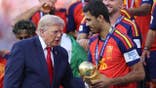 Donald Trump presents the FIFA World Cup trophy to Rodri.