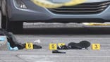 evidence markers near clothes on ground