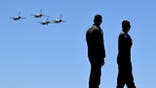 airmen turning to watch Thunderbirds fly overhead