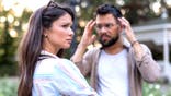 Stock image of woman and man during an outdoor argument.