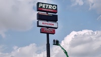AJ Gow spent over six hours trapped inside a 130-foot gas station sign in Wilmington, Illinois, after his boom lift malfunctioned during repair work.