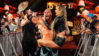 WWE's Maxxine Dupri helps Austin Theory and Bron Breakker win World Tag Team Championship, seals win with kiss