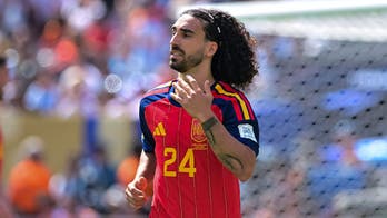Spanish soccer player makes good on his promise to get tattoo of team's manager after World Cup win