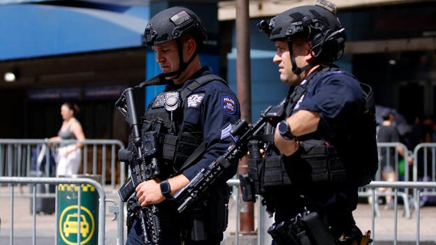 Armed police officers stand guard outside Madison Square Garden