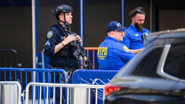 An armed police officer stands outside Madison Square Garden ahead of Taylor Swift's reported wedding