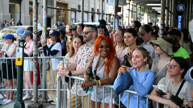 Fans stand outside Madison Square Garden where Taylor Swift and Travis Kelce are rumored to be getting married