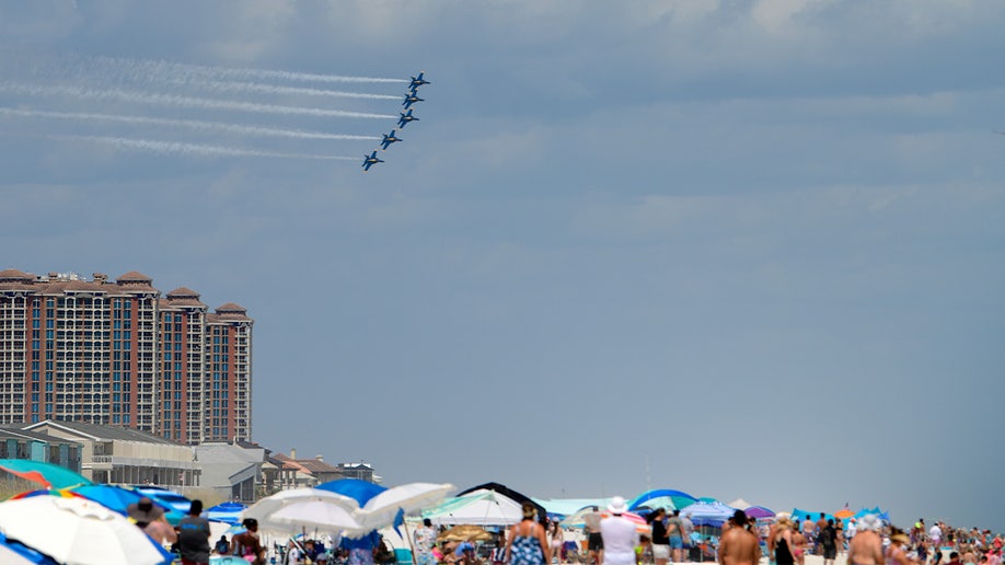 The Blue Angels fly in formation over Pensacola Beach.